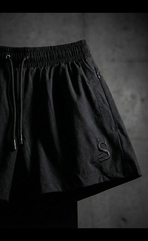 Australian gym shorts men - Stay Shredded embossed logo on premium mens leg day shorts showing quality construction and branding detail