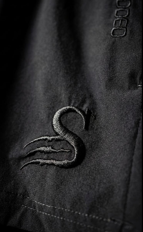 Mens gym shorts Australia close-up showing embroidered S logo - premium leg day shorts for Australian lifters with quality stitching