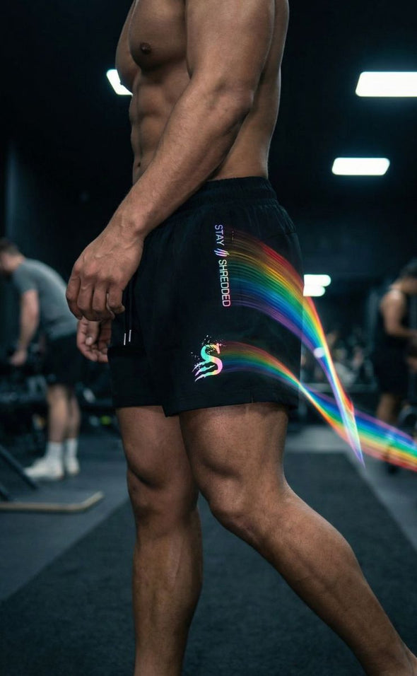 Reflective gym shorts men Australia in gym setting - Trip Reflective leg day shorts showing rainbow colour changing effect under gym lighting for Australian lifters