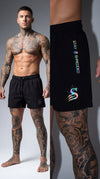Trip Reflective gym shorts mens Australia studio shot showing iridescent rainbow logos on black leg day shorts - professional model wearing Stay Shredded colour changing gym shorts with detail close-up